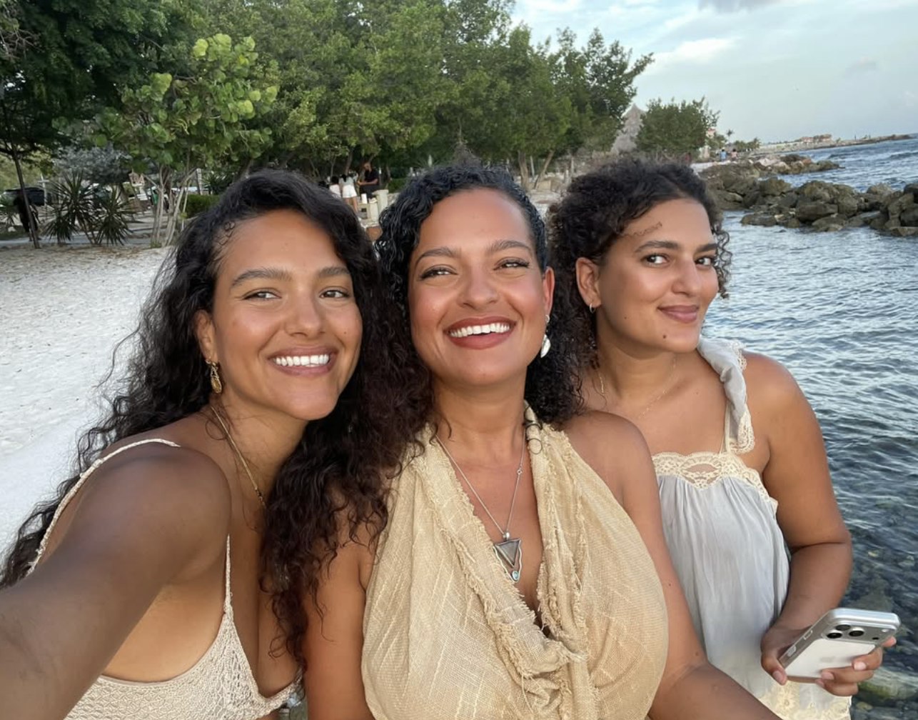 Joline with her sisters on the beach